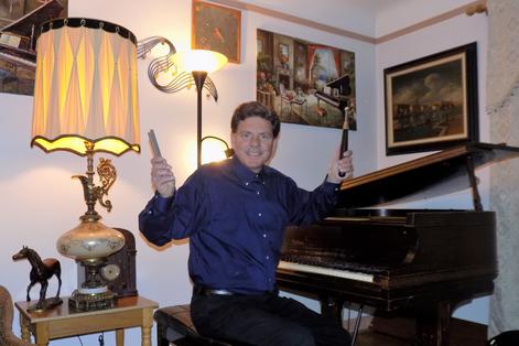 Allen Schwamm Gabka at the grand piano in his music studio